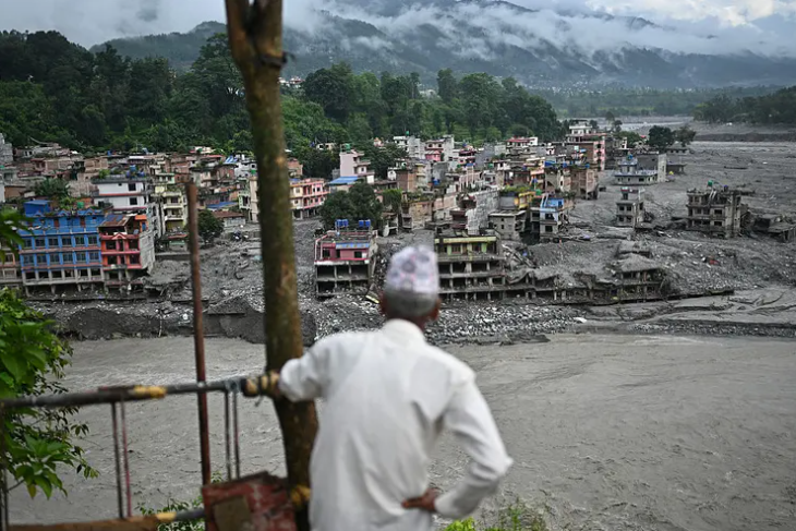 A man looks at the devastation in the aftermath of floods at Trishuli in Nepal's Nuwakot district on September 7, 2026.Pedro Pardo-AFP via Getty Images